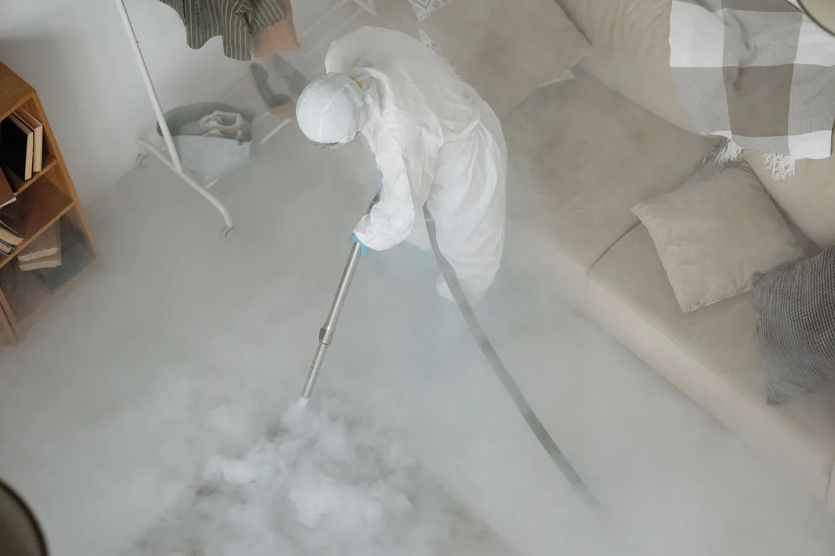 Biohazard cleanup technician in protective equipment, Thornton Park, Santa Ana, CA